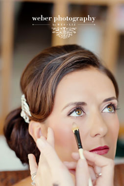 picture of a professional makeup artist applying wedding makeup